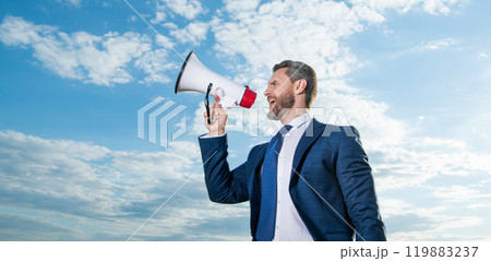 businessman shout in megaphone on sky background businessman shout in megaphone on sky background 119883237