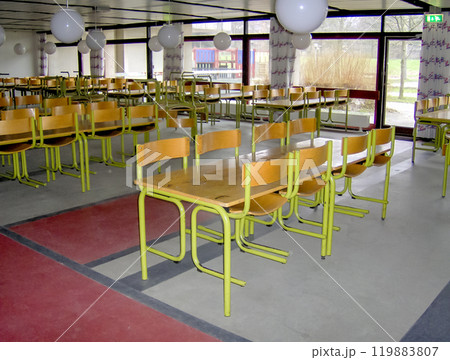 Empty classroom with desks and chairs at school. 119883807