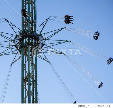 Amusement park. Spinning carousel at Tivoli Gardens. 119883823