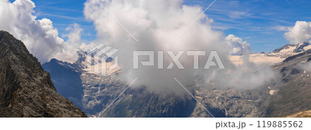 Panoramic Mountain View with Snow-Capped Peaks and Clouds 119885562