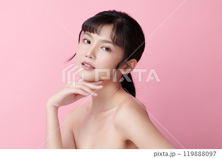 Beautiful young asian woman with clean fresh skin on pink background, Face care, Facial treatment, Cosmetology, beauty and spa, Asian women portrait. Beautiful young asian woman with clean fresh skin on pink background, Face care, Facial treatment, Cosmetology, beauty and spa, Asian women portrait. 119888097