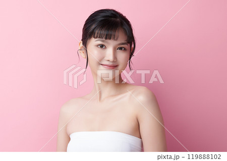 Beautiful young asian woman with clean fresh skin on pink background, Face care, Facial treatment, Cosmetology, beauty and spa, Asian women portrait. 119888102