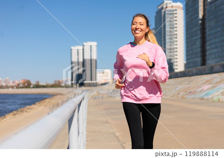 Woman jogging running on city embankment with graffiti enjoy outdoor sport activity 119888114