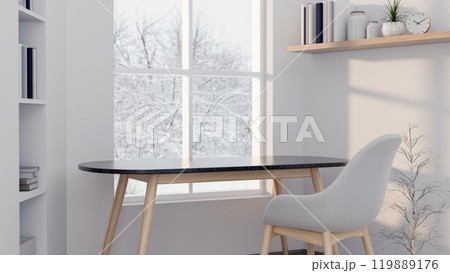 A minimalist display area on a simple table by a window with snowy scenery outsides in a white room. 119889176