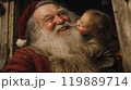 笑顔のサンタクロースに抱きつく子ども 119889714