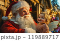 クリスマスを祝うサンタクロースと赤ちゃん天使 119889717