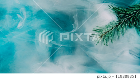 Fog pine sprig. Vapor cloud. Green needle tree in blue white color ink water mix fume floating wave texture winter abstract background. Fog pine sprig. Vapor cloud. Green needle tree in blue white color ink water mix fume floating wave texture winter abstract background. 119889851