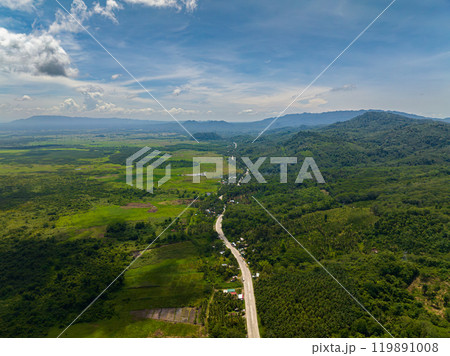 Tropical mountain road on countryside, green forest and vegetation. Mindanao, Philippines. Tropical mountain road on countryside, green forest and vegetation. Mindanao, Philippines. 119891008