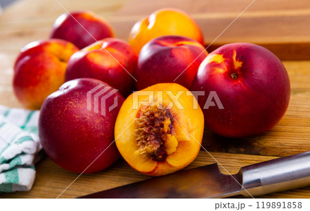 Ripe fresh juicy nectarines on wooden background, harvest season 119891858