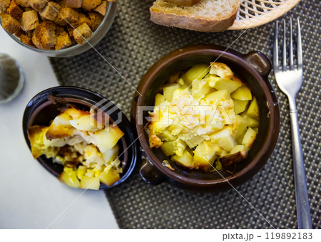 Clay pot with delicious roast and potatoes closeup 119892183