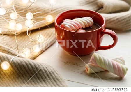 Cup of delicious hot chocolate on wooden table background. 119893731