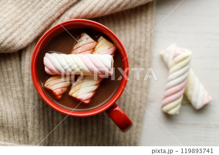Cup of delicious hot chocolate on wooden table background. Cup of delicious hot chocolate on wooden table background. 119893741