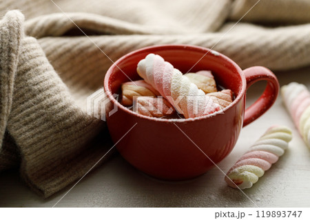 Cup of delicious hot chocolate on wooden table background. 119893747