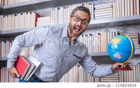 man teacher in classroom. school lesson. Hispanic teacher at school. school teachers education and knowledge. Educational opportunities. man teacher in class. teachers day. college teacher man teacher in classroom. school lesson. Hispanic teacher at school. school teachers education and knowledge. Educational opportunities. man teacher in class. teachers day. college teacher 119893934