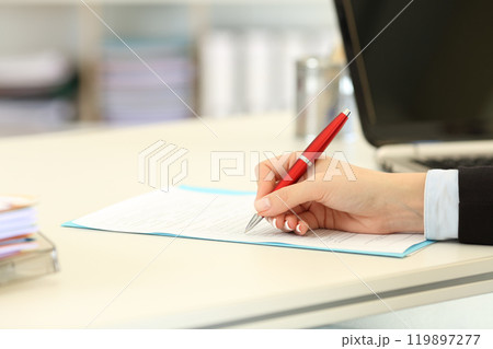 Close up of an executive hand filling form Close up of an executive hand filling form 119897277