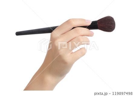 Woman hand using a makeup brush Woman hand using a makeup brush 119897498