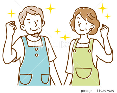 笑顔でガッツポーズするエプロン姿の中年の夫婦 119897989