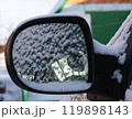 Rearview mirror of a car in the snow. Close up 119898143