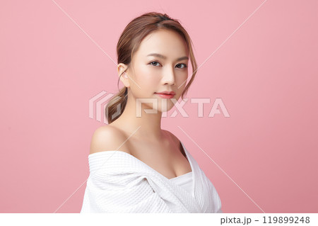 Beautiful young asian woman with clean fresh skin on pink background, Face care, Facial treatment, Cosmetology, beauty and spa, Asian women portrait. Beautiful young asian woman with clean fresh skin on pink background, Face care, Facial treatment, Cosmetology, beauty and spa, Asian women portrait. 119899248