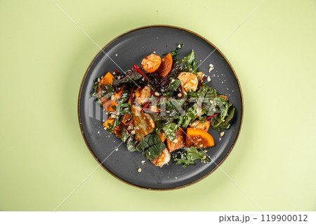 Portion of salad with persimmons and shrimps Portion of salad with persimmons and shrimps 119900012