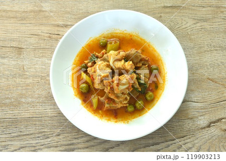 spicy fried pork soft bone with curry and eggplant on plate spicy fried pork soft bone with curry and eggplant on plate 119903213