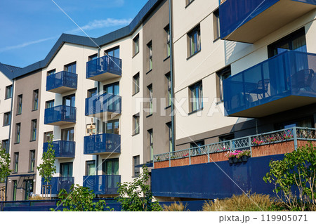 Residential building facade with balconies at summer day Residential building facade with balconies at summer day 119905071