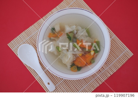 A bowl of vegetable soup on a table 119907196