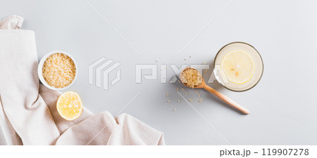 Trendy rice and lemon drink to reduce appetite in a glass on the table top view web banner 119907278