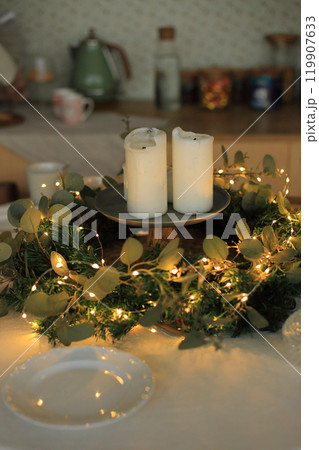 This enchanting Christmas table setting captures the warmth and joy of the holiday season. Adorned with twinkling fairy lights, elegant dinnerware, and seasonal decorations, the table is a perfect This enchanting Christmas table setting captures the warmth and joy of the holiday season. Adorned with twinkling fairy lights, elegant dinnerware, and seasonal decorations, the table is a perfect 119907633