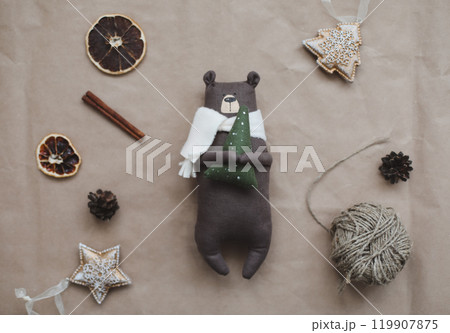 Christmas composition. Toy bear and decorations. Christmas, winter, new year concept. Flat lay, top view, copy space Christmas composition. Toy bear and decorations. Christmas, winter, new year concept. Flat lay, top view, copy space 119907875