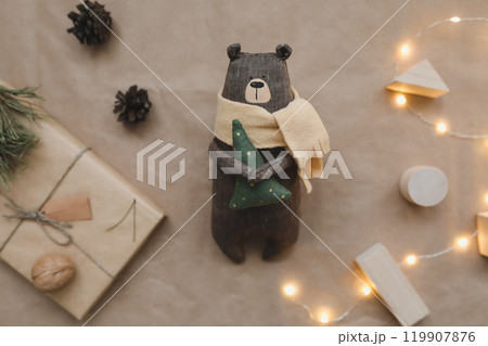 Christmas composition. Toy bear and decorations. Christmas, winter, new year concept. Flat lay, top view, copy space Christmas composition. Toy bear and decorations. Christmas, winter, new year concept. Flat lay, top view, copy space 119907876