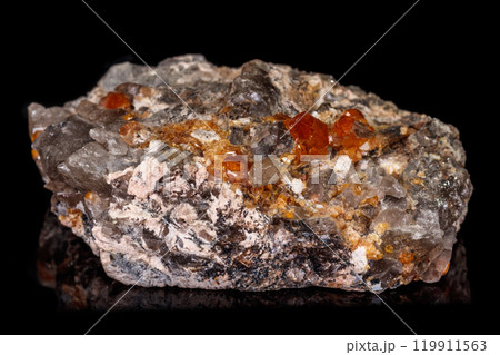 macro mineral stone Grossular, Garnet, Epidote on a black background macro mineral stone Grossular, Garnet, Epidote on a black background 119911563