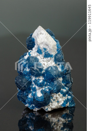macro mineral stone Fluorite on quartz on a gray background 119911645