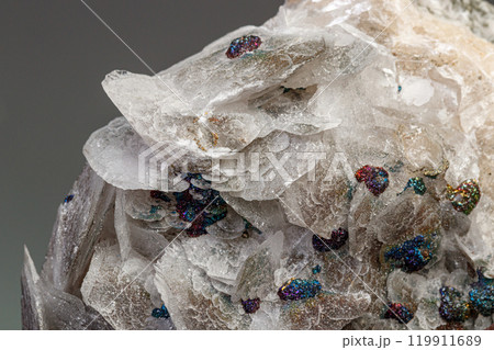 Macro Calcite Stone Minerals with Chalcopyrite on a Gray Background Macro Calcite Stone Minerals with Chalcopyrite on a Gray Background 119911689