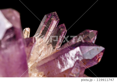 Macro of amethyst mineral stone on black background 119911747