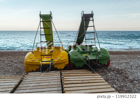 Slide in the form of a car on the beach Slide in the form of a car on the beach 119912322