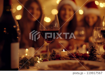 Photo of nice joyful family people drinking red wine and having Christmas dinner. 119917567