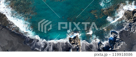 Atlantic ocean with waves and black basalt sand and rocks, view from above Atlantic ocean with waves and black basalt sand and rocks, view from above 119918086