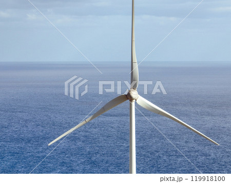 Wind power station with wind turbines with an ocean on the background, Wind power station with wind turbines with an ocean on the background, 119918100