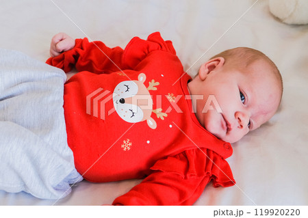 Sleeping infant baby with many dolls rabbit on white blanket newborn concept 119920220