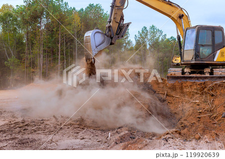 Earth loading is process of moving earth using an excavator 119920639