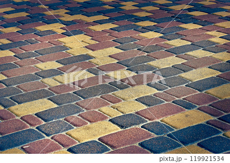 Paving tile colored stones. Cobblestone pavement 119921534