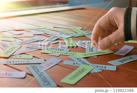 hand picking up cards in class hand picking up cards in class 119922389