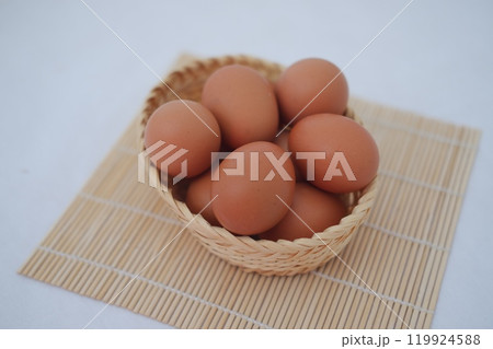 eggs in a rattan basket on a white background eggs in a rattan basket on a white background 119924588