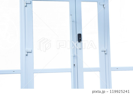 Metal plastic facade doors with a bell, video communication on white 119925241