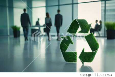 green recycling symbol in office on blurred background of employees 119925703