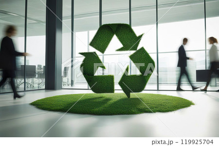 green recycling symbol in office on blurred background of employees 119925704