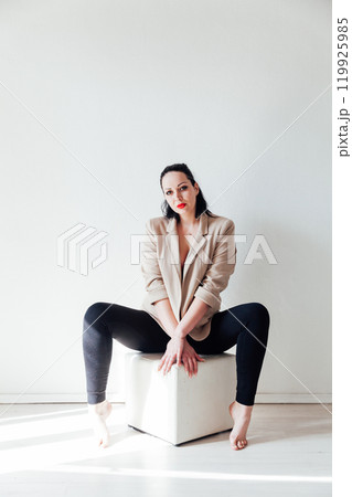 Beautiful plump brunette woman in a business suit 119925985