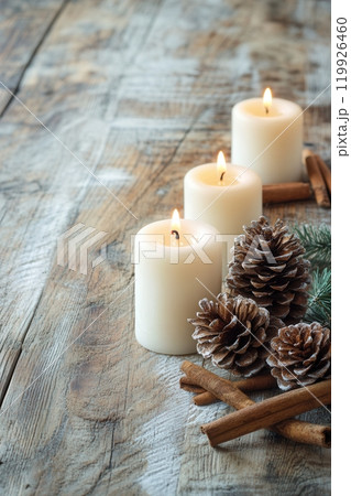 Christmas Still Life with Pinecones, Cinnamon, and Candleligh 119926460