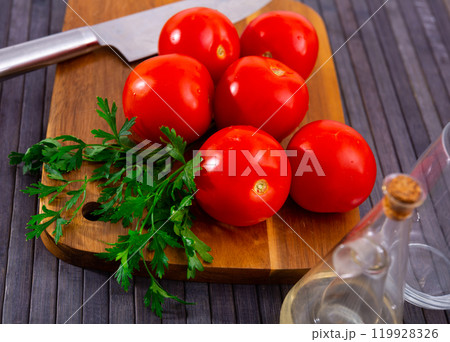 Fresh red tomatoes on wooden table Fresh red tomatoes on wooden table 119928326